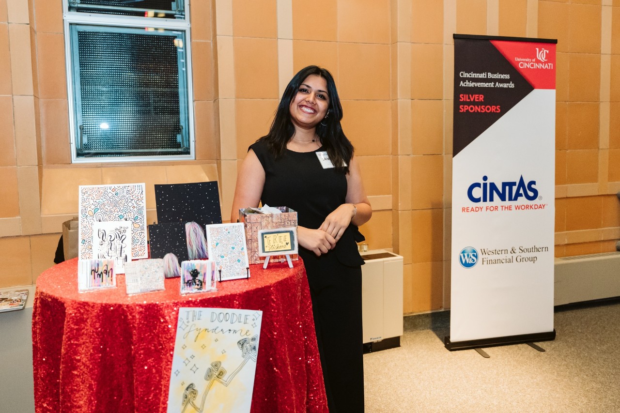Student at table with her business wares