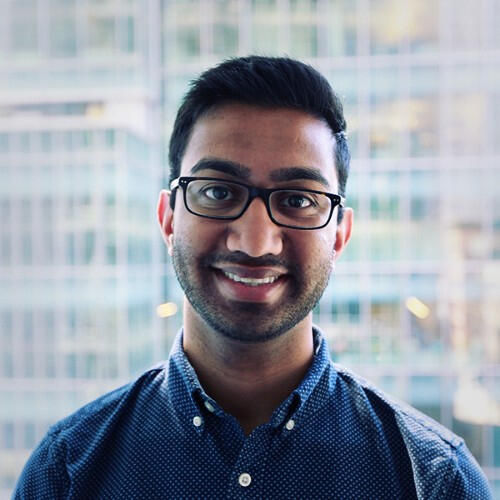 rahul's professional headshot in a blue button up 