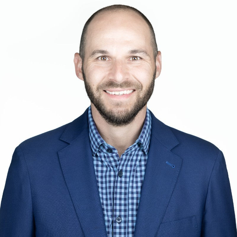 professional headshot of peter in a suite 