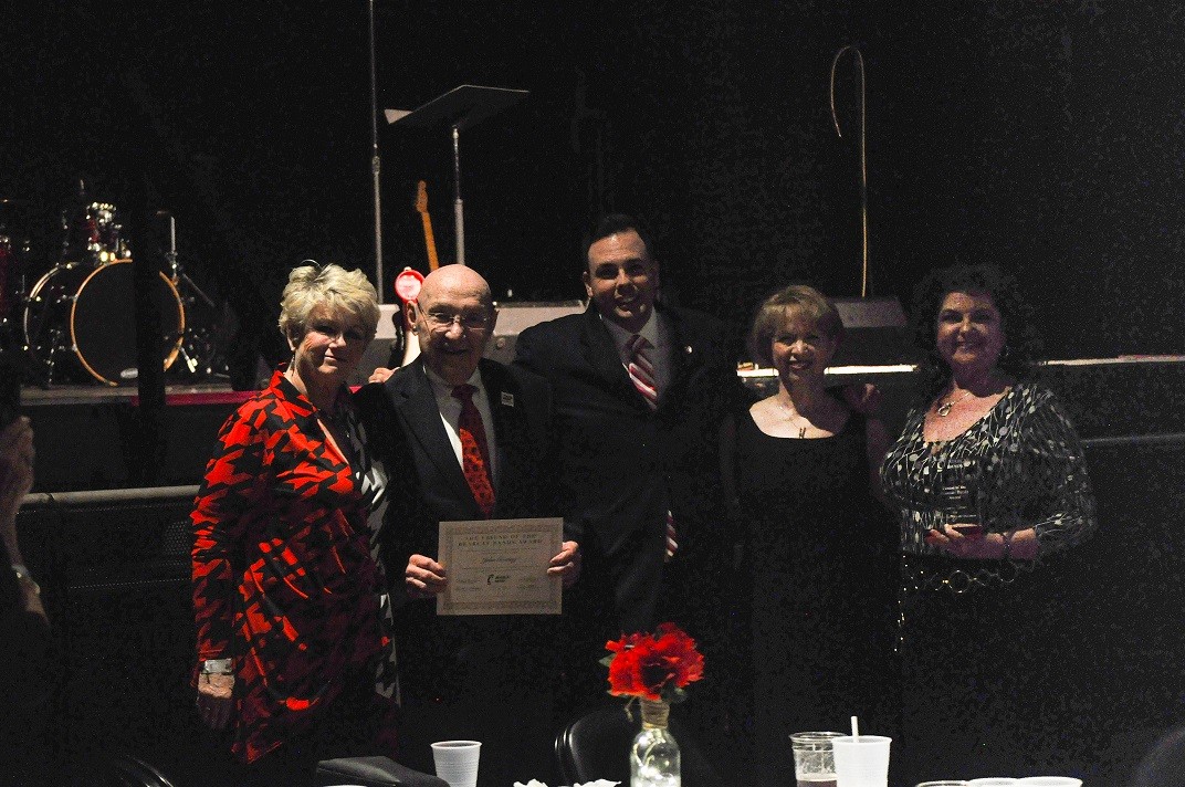 John Goering with MB Hammond, Carol Butler, Cathy Decker holding Bearcat Band Award