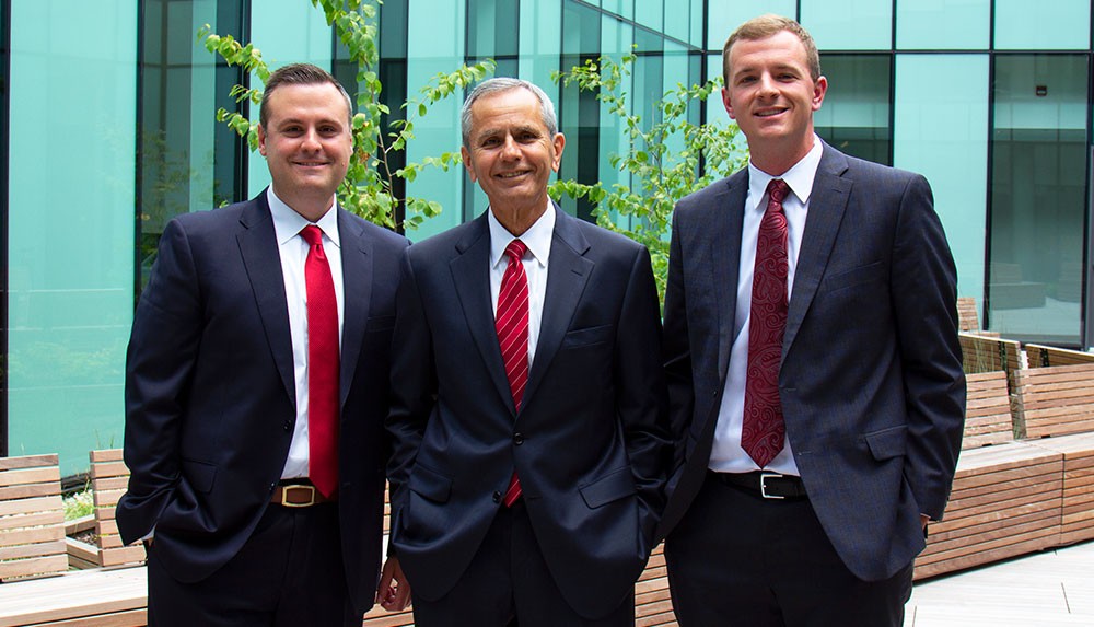Dan Snow, Mire Jonovski, and Dustin Martin in Lindner Hall's courtyard