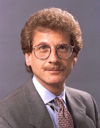 Larry Horwitz in a gray suit and tie and white shirt.