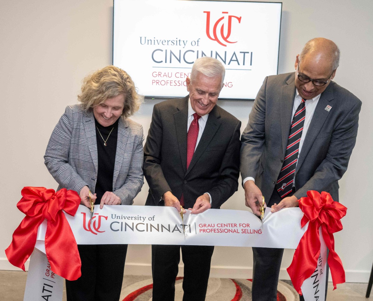 Dr. Neville G. Pinto, president of University of Cincinnati, Marianne Lewis, Dean of University of Cincinnati Lindner College of Business shown here with students, faculty as they enjoyed Jim Grau’s Grau Center Professional Selling Lab ribbon cutting ceremony Wednesday March 5, 2025 at the Lindner College. Photos by Joseph Fuqua II 
