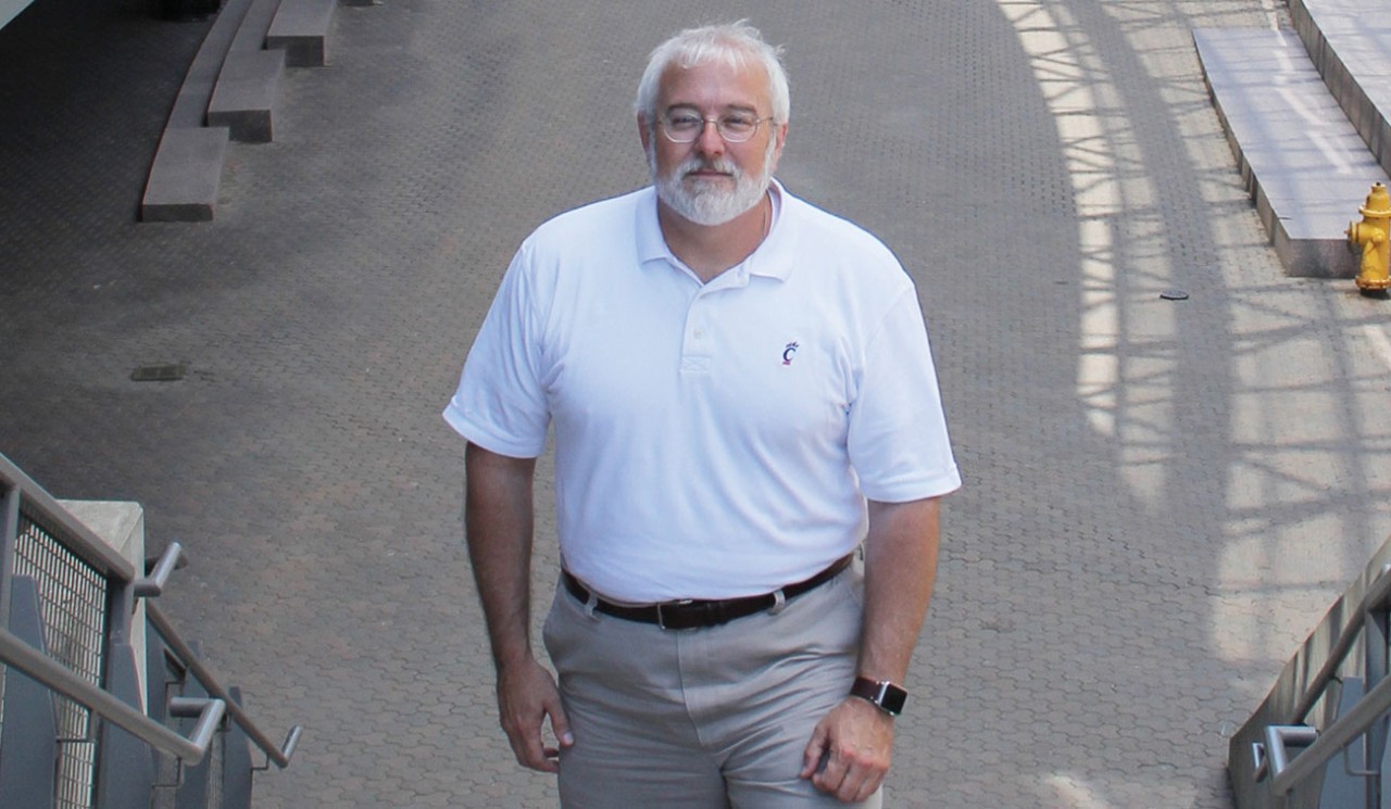 Image of Professor Robert S. Rokey standing on UC's Main Street