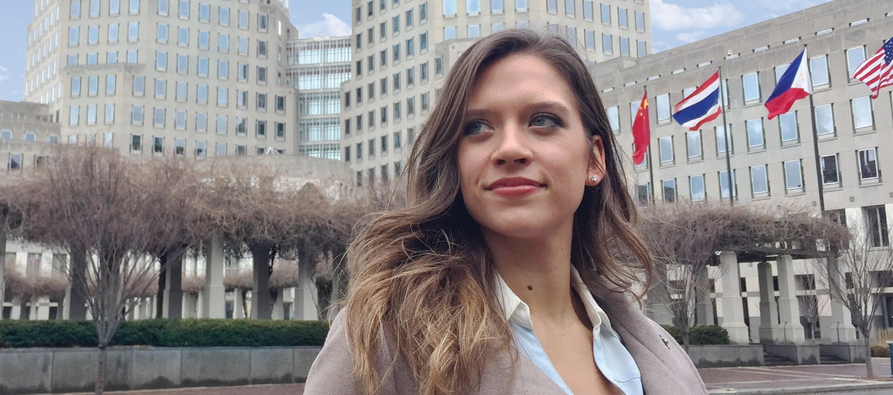 Jenna Hagglund standing in front of P&G headquarters in downtown Cincinnati.