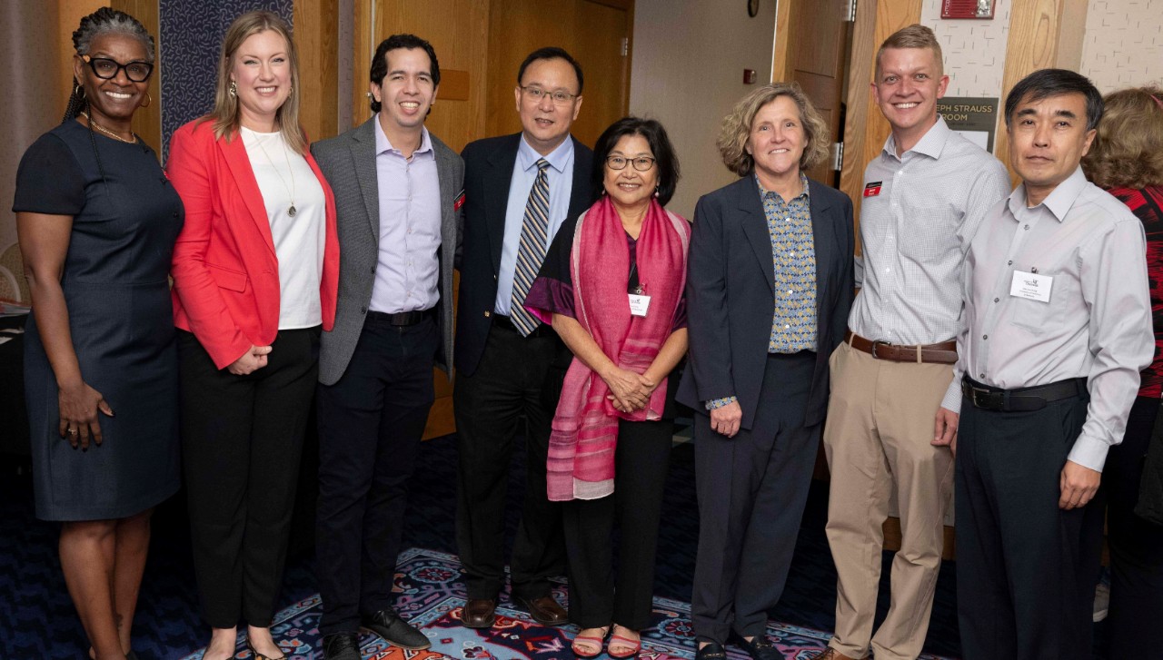 Accounting professors and staff members in professional dress, along with Lindner dean Marianne Lewis.