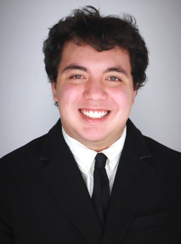 Jack Ernst wears a suit and tie.